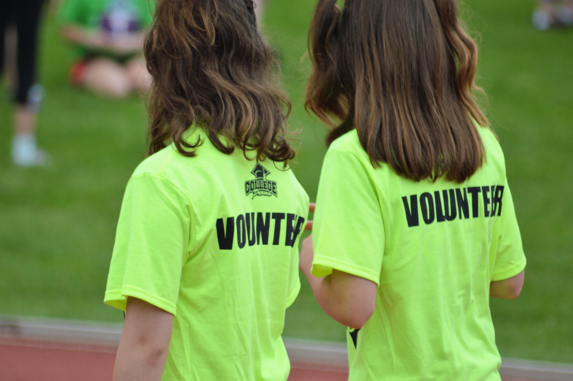 Volunteers! People from behind. Twining. Teens. Twin Sisters. Volunteering. Volunteers.